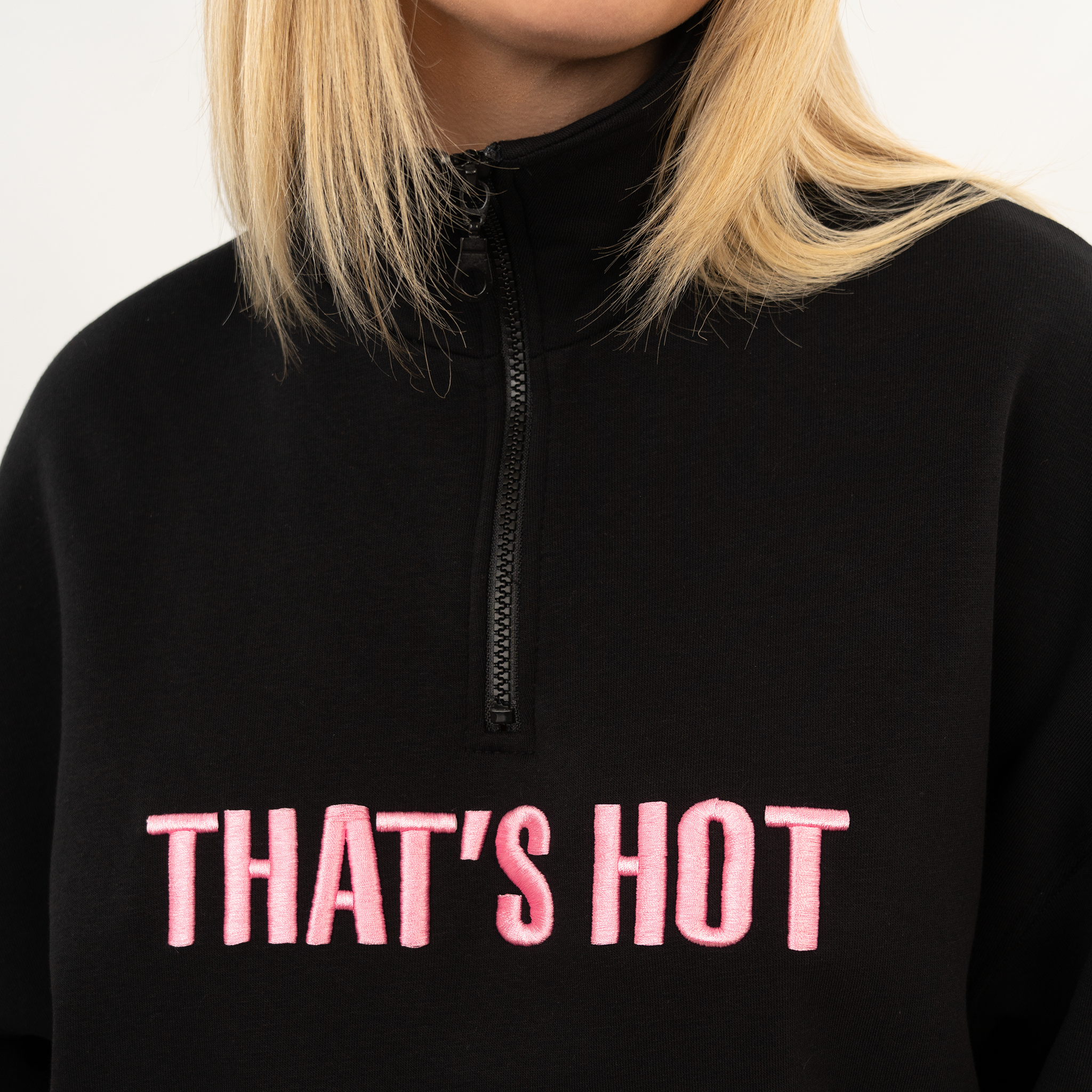 That's Hot black, half-zip sweatshirt