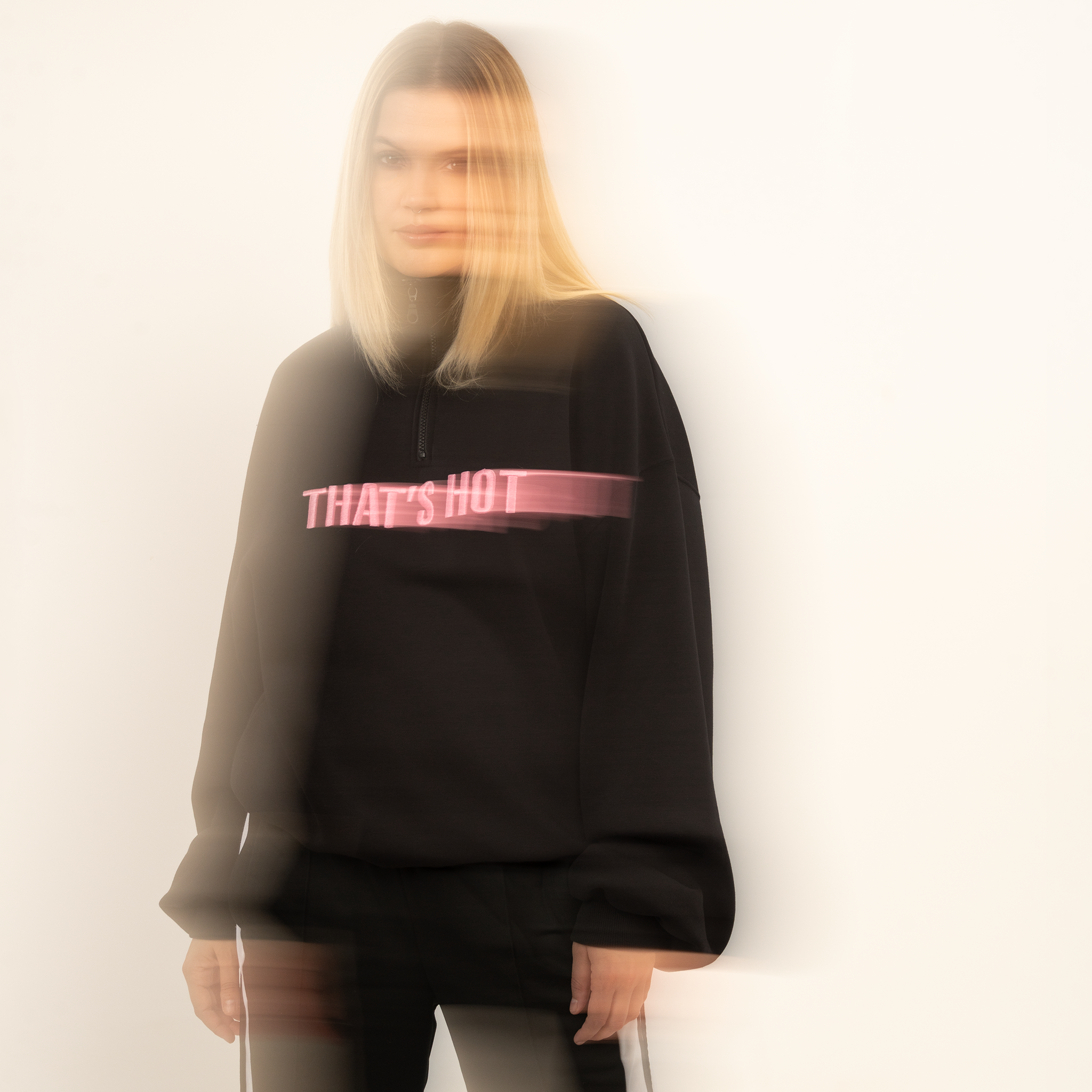 That's Hot black, half-zip sweatshirt